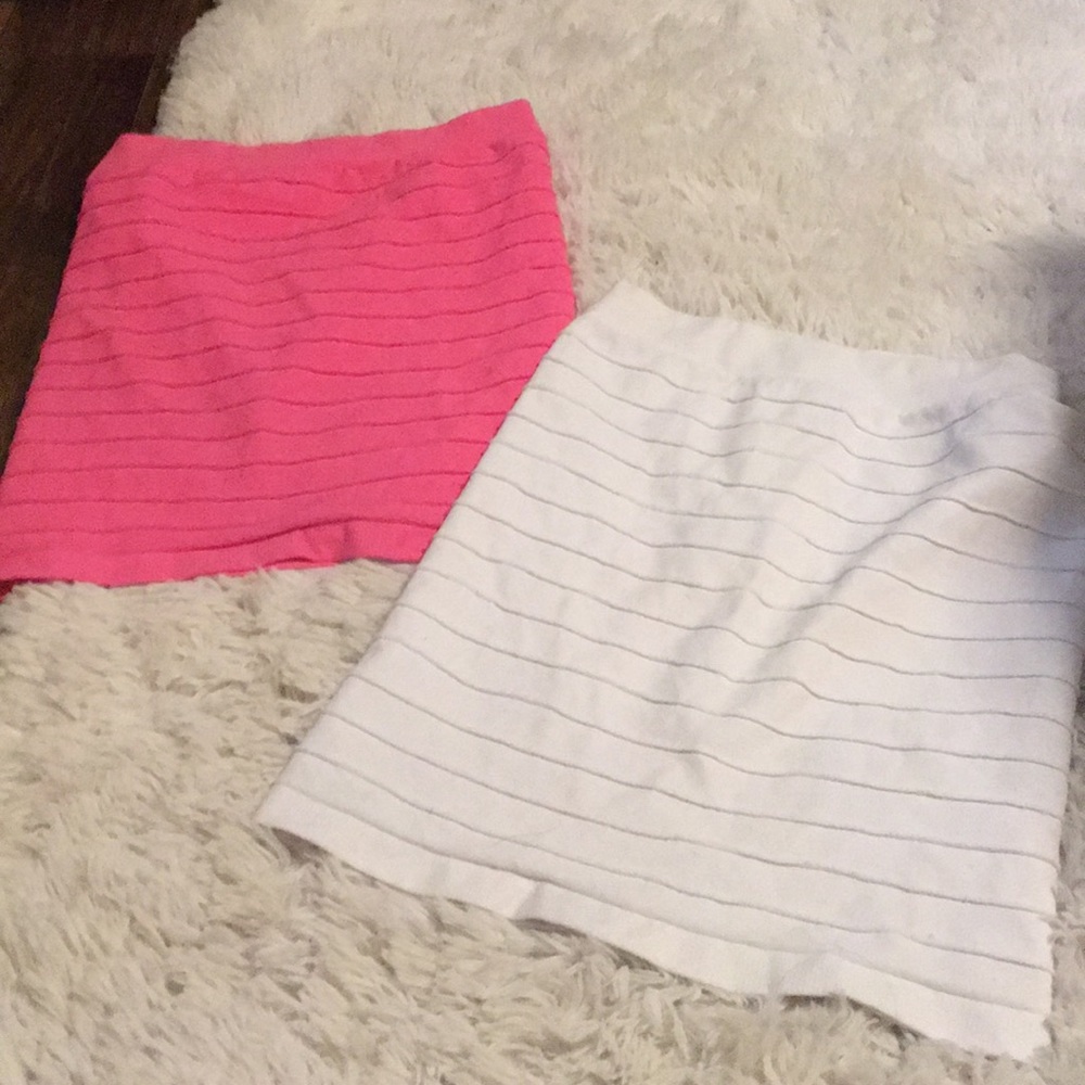 Pair of Bebe stretch mini skirts white+ hot pink